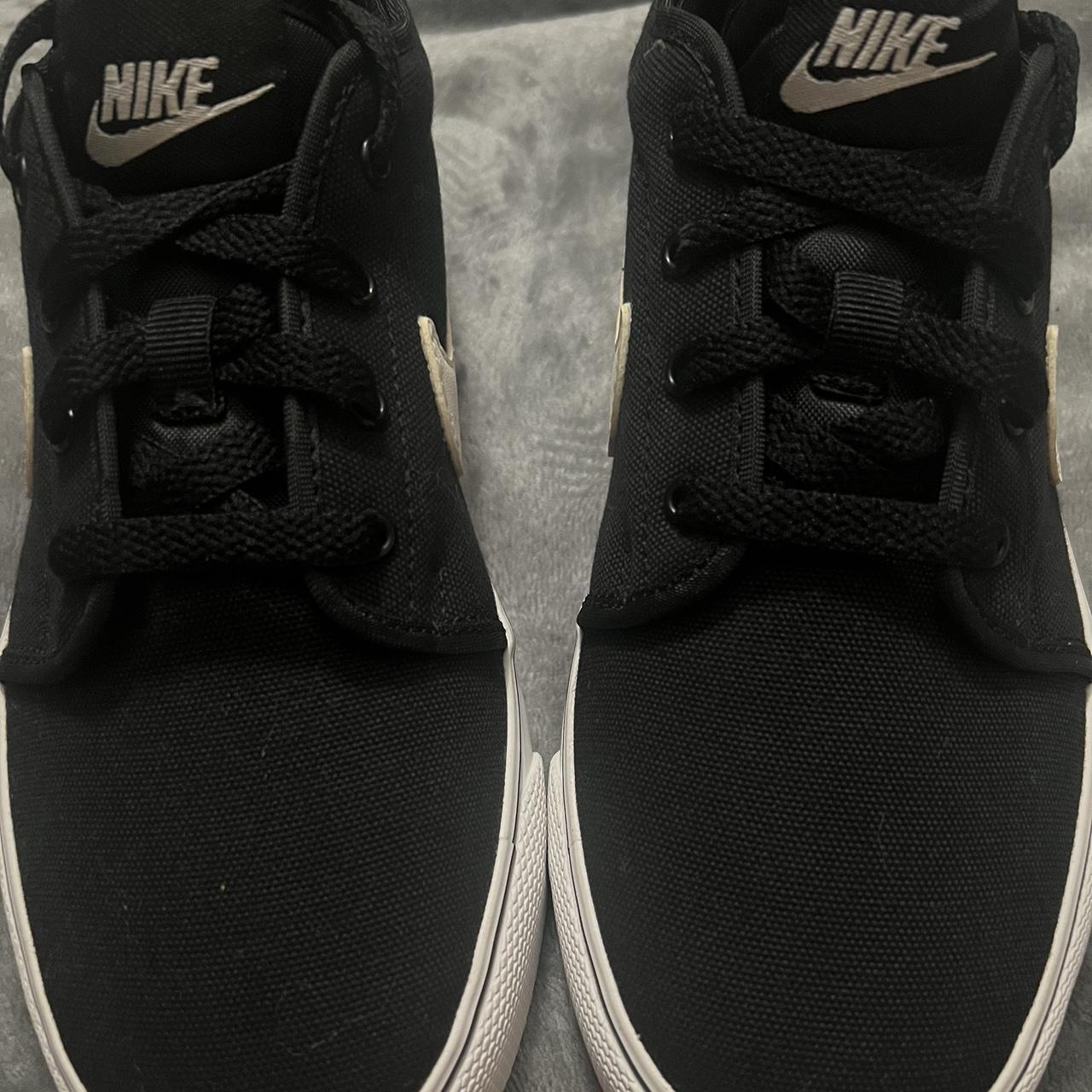 nike toki low all black