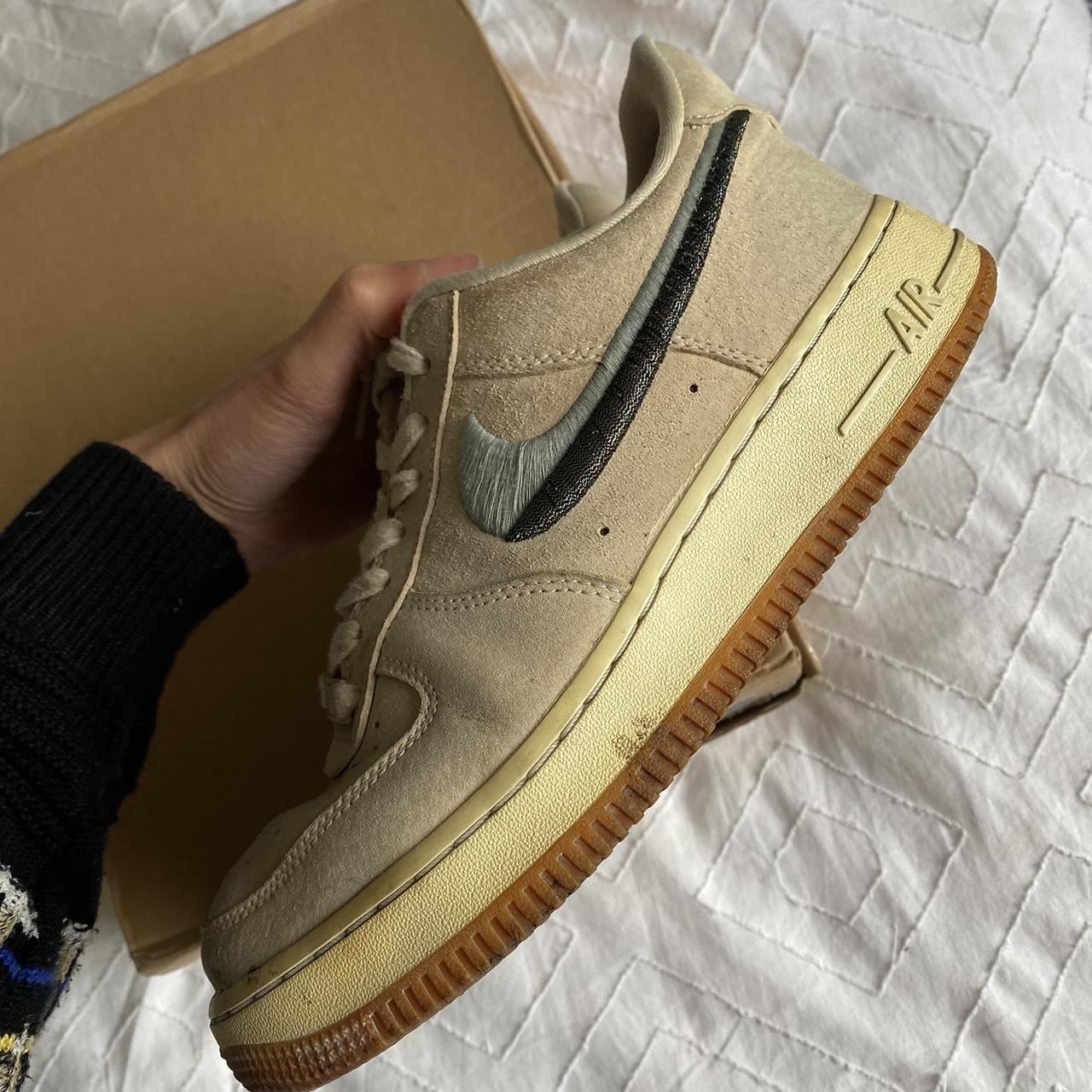 Beige Nike Air Force 1 Low SE 07 trainers with blue. Depop