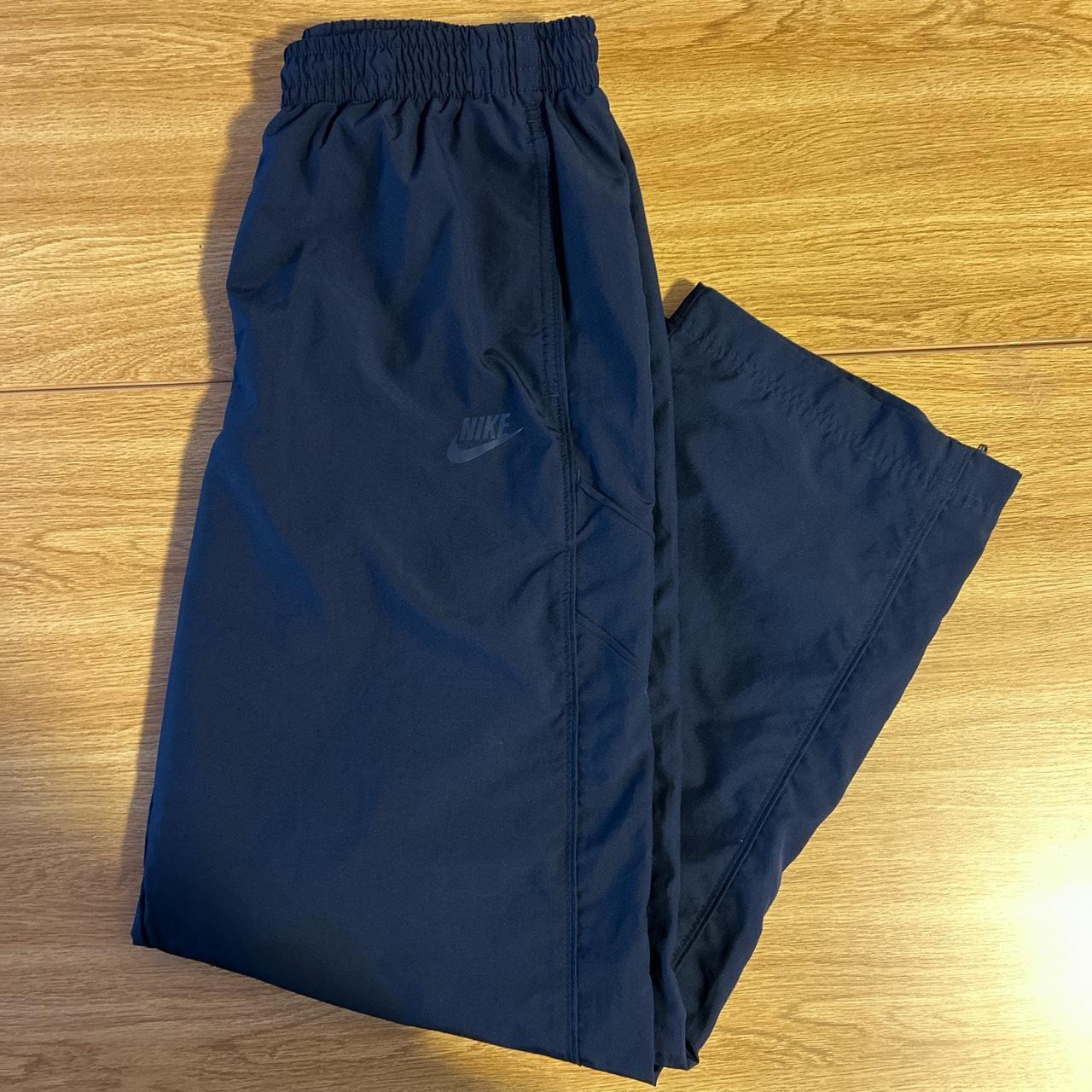 nike track pants dark blue