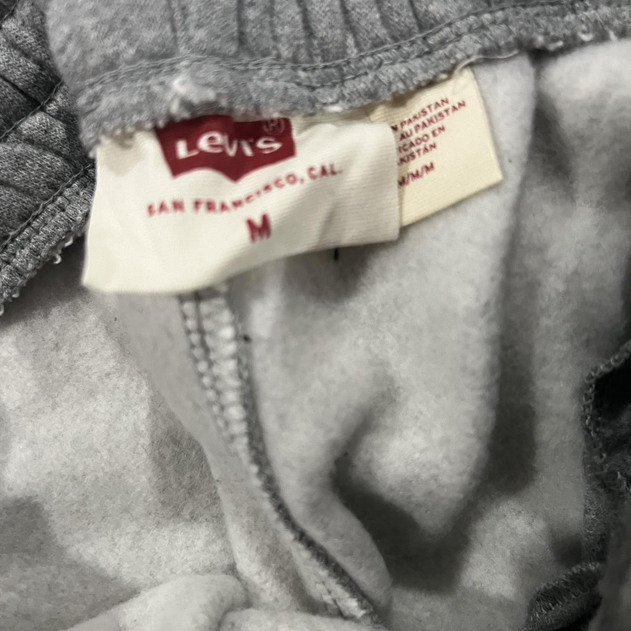 gray never worn Levi sweatpants with tag still on it... - Depop