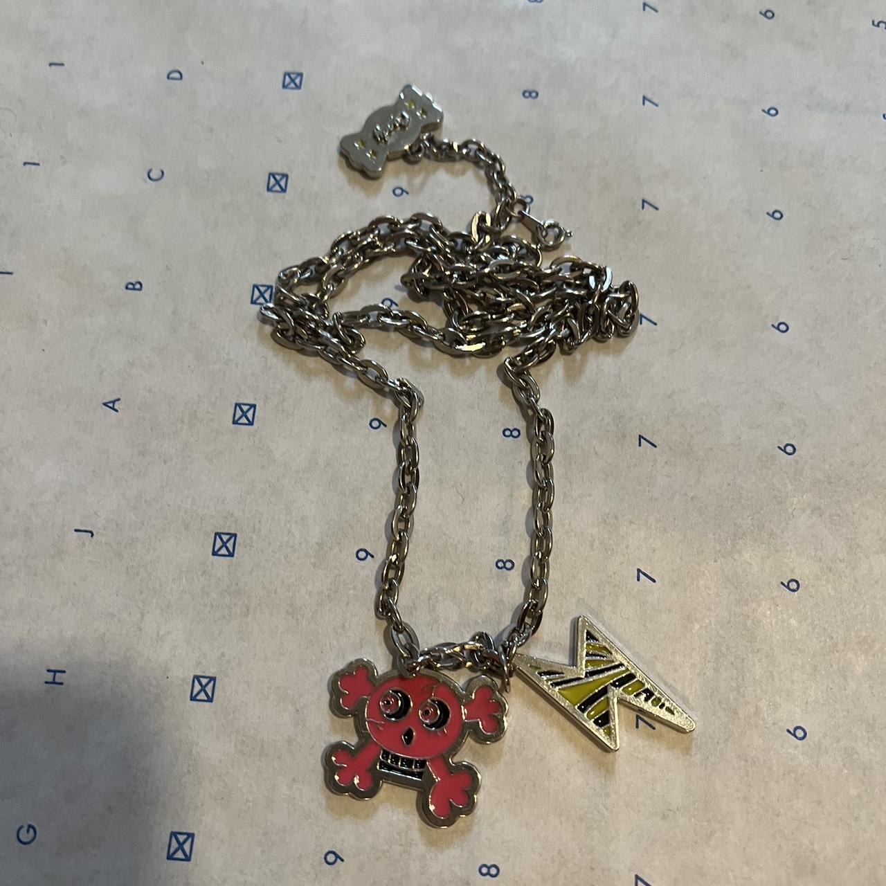 Louis Vuitton flame necklace - Depop