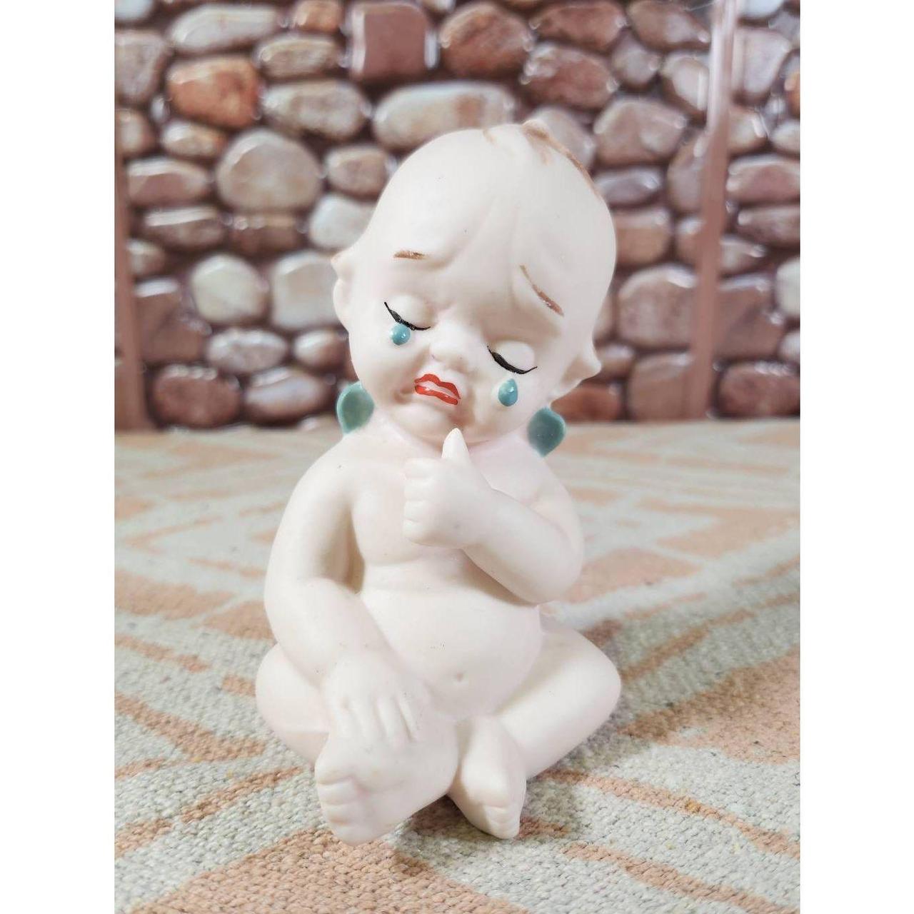 This vintage bisque blue winged Kewpie doll figurine. Depop