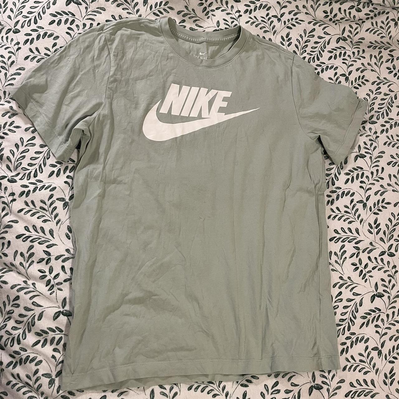 white and olive green nike shirt