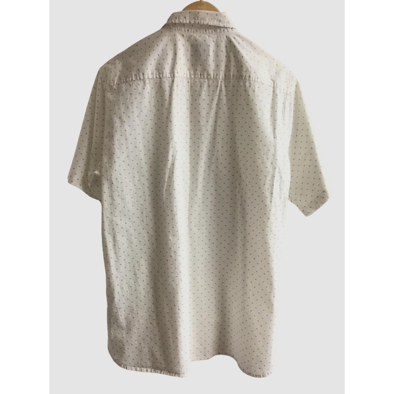 This short-sleeve button-down shirt from VOYAGER. It... - Depop