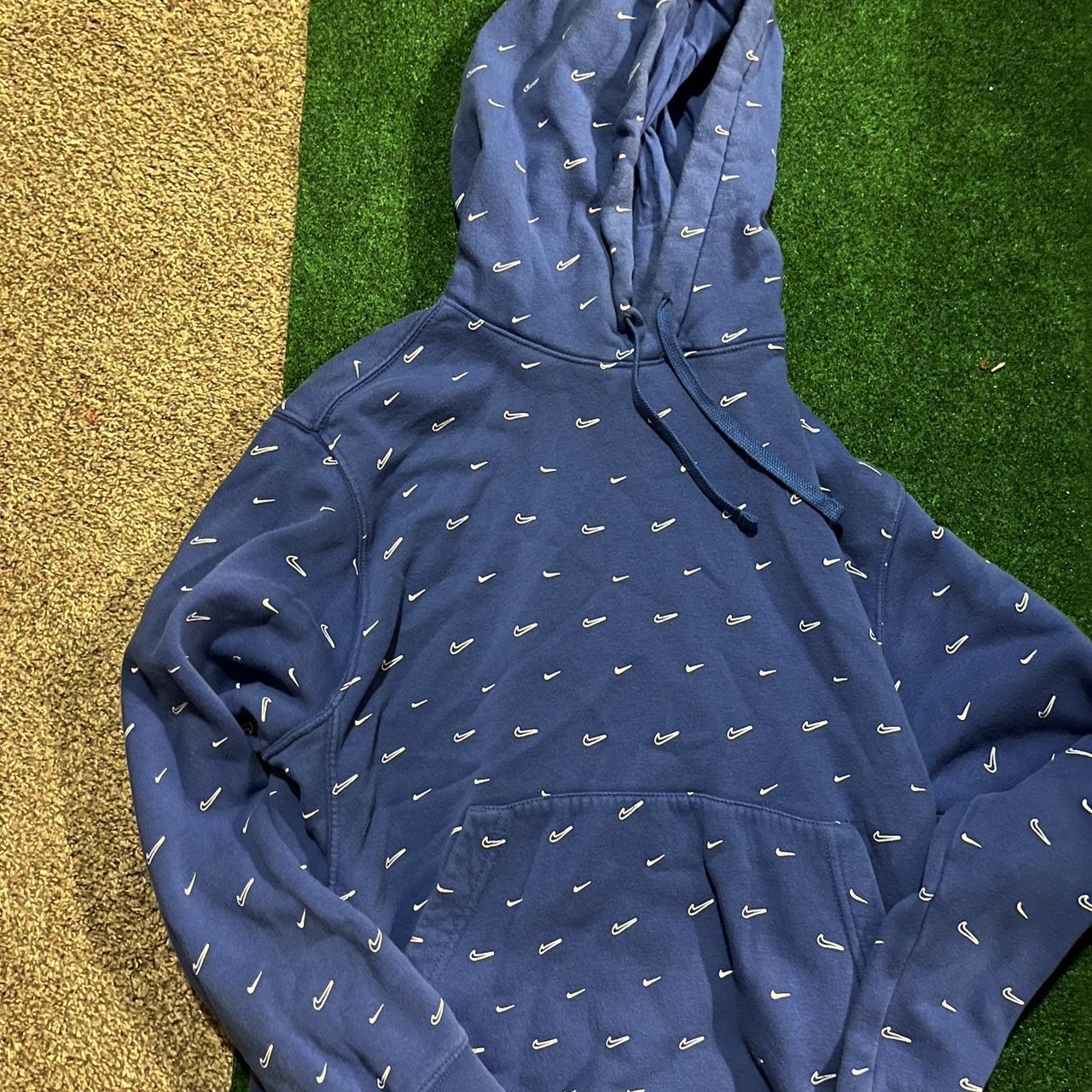 white nike hoodie with blue swoosh