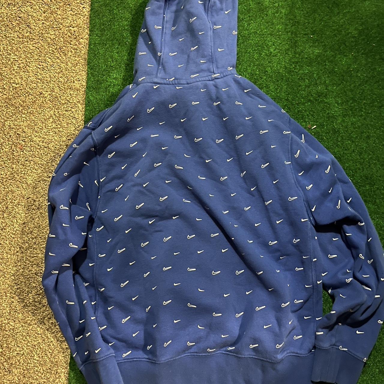 white nike hoodie with blue swoosh