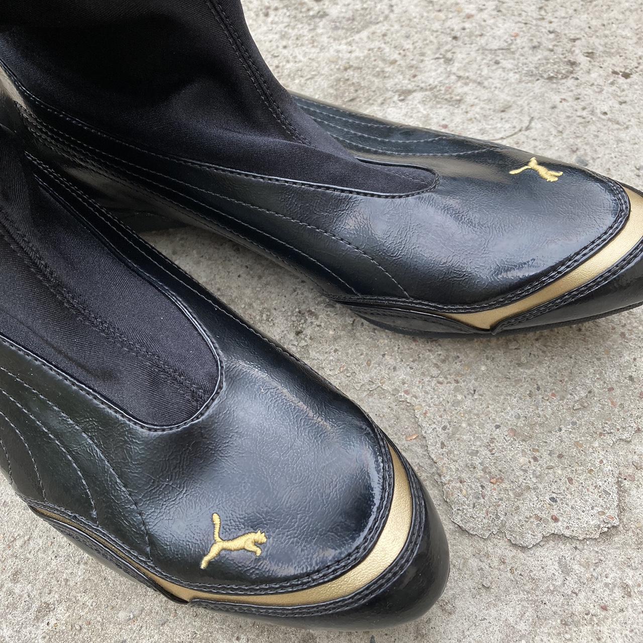 Puma Women's Black and Gold Boots Depop