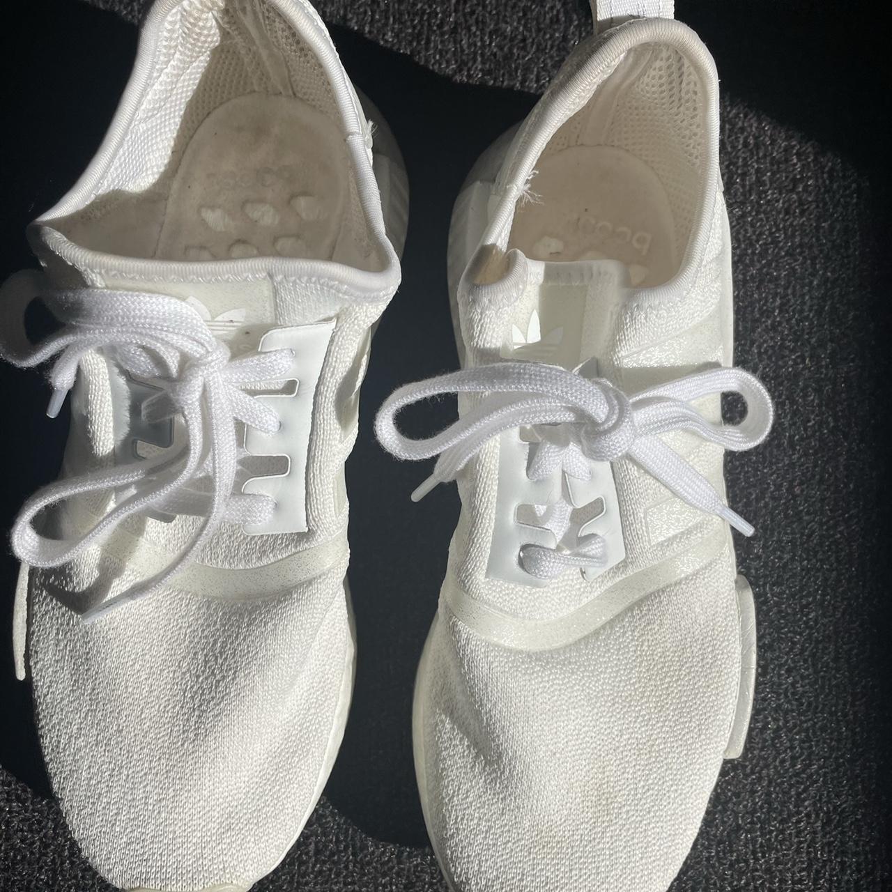 white nmds with blue