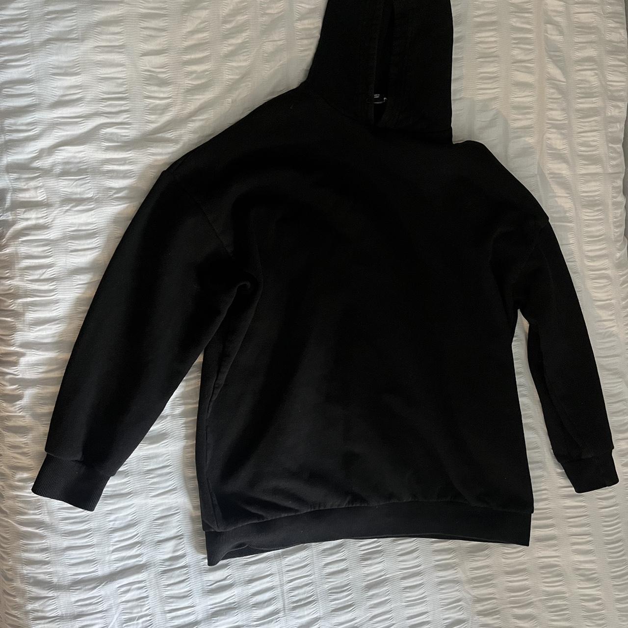 Black hoodie with white writing on back. Slight wear