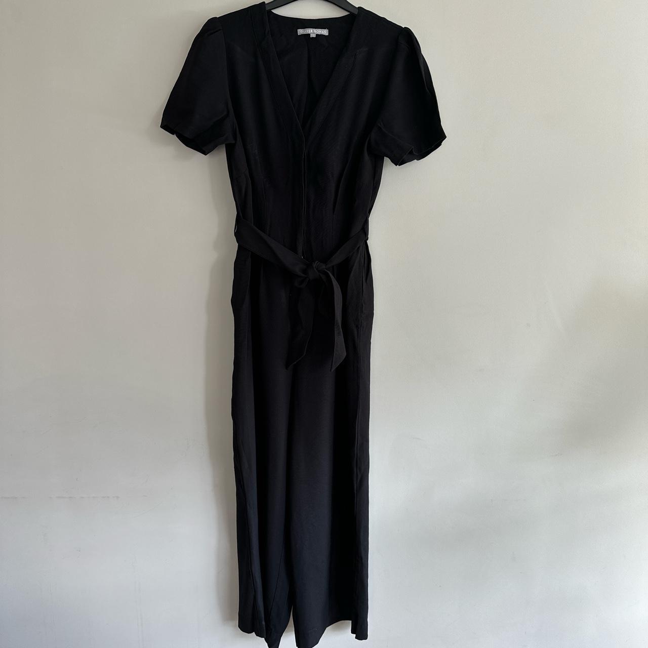 Oliver Bonas black jumpsuit. Hidden buttons at the... - Depop