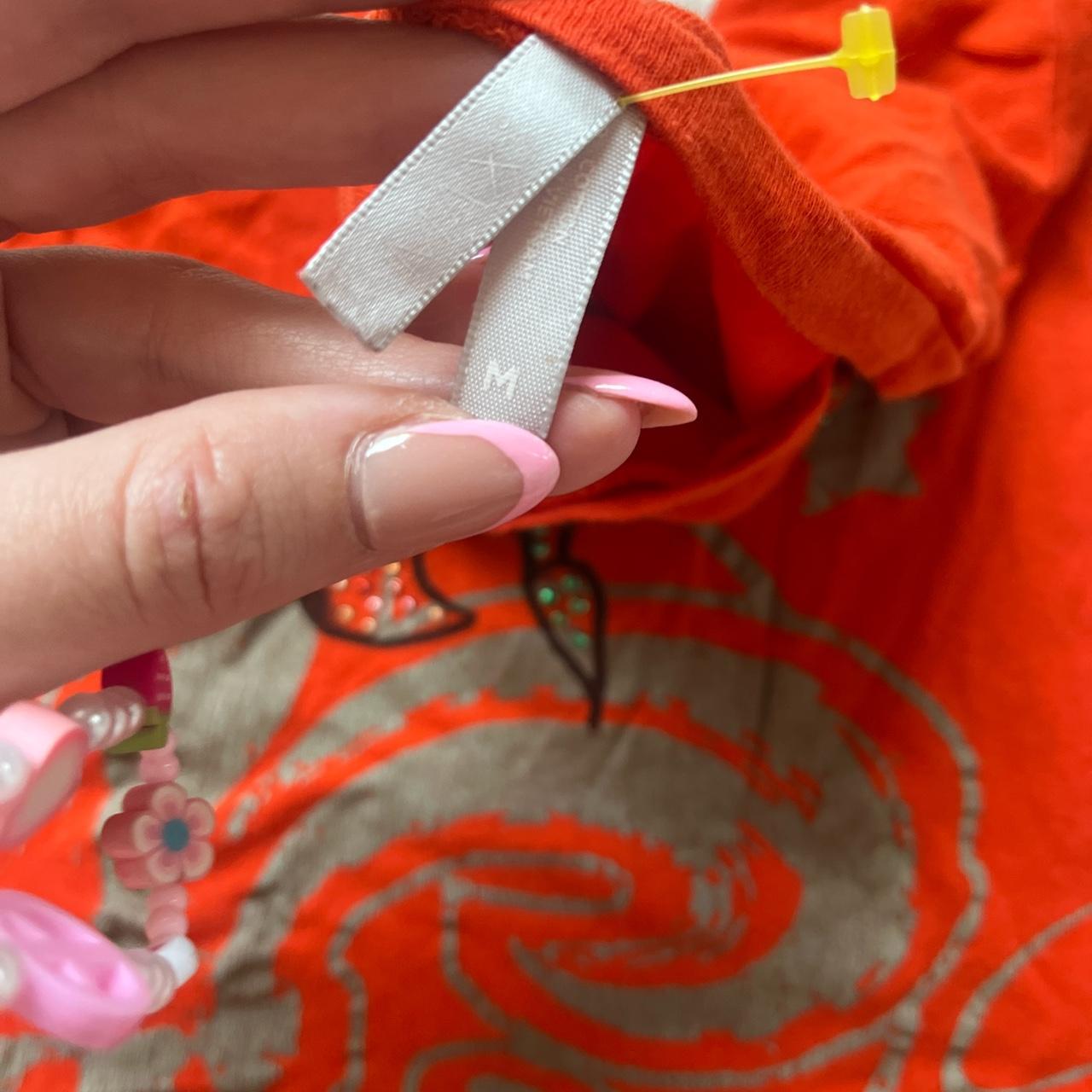 Bright blood orange Ed hardy looking short sleeve... Depop