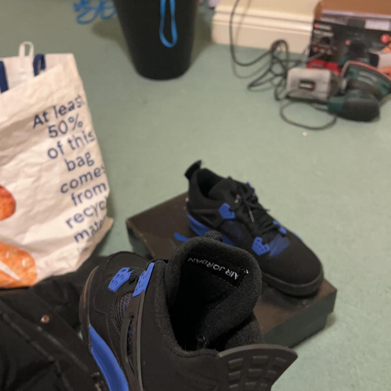 jordan blue and black shoes