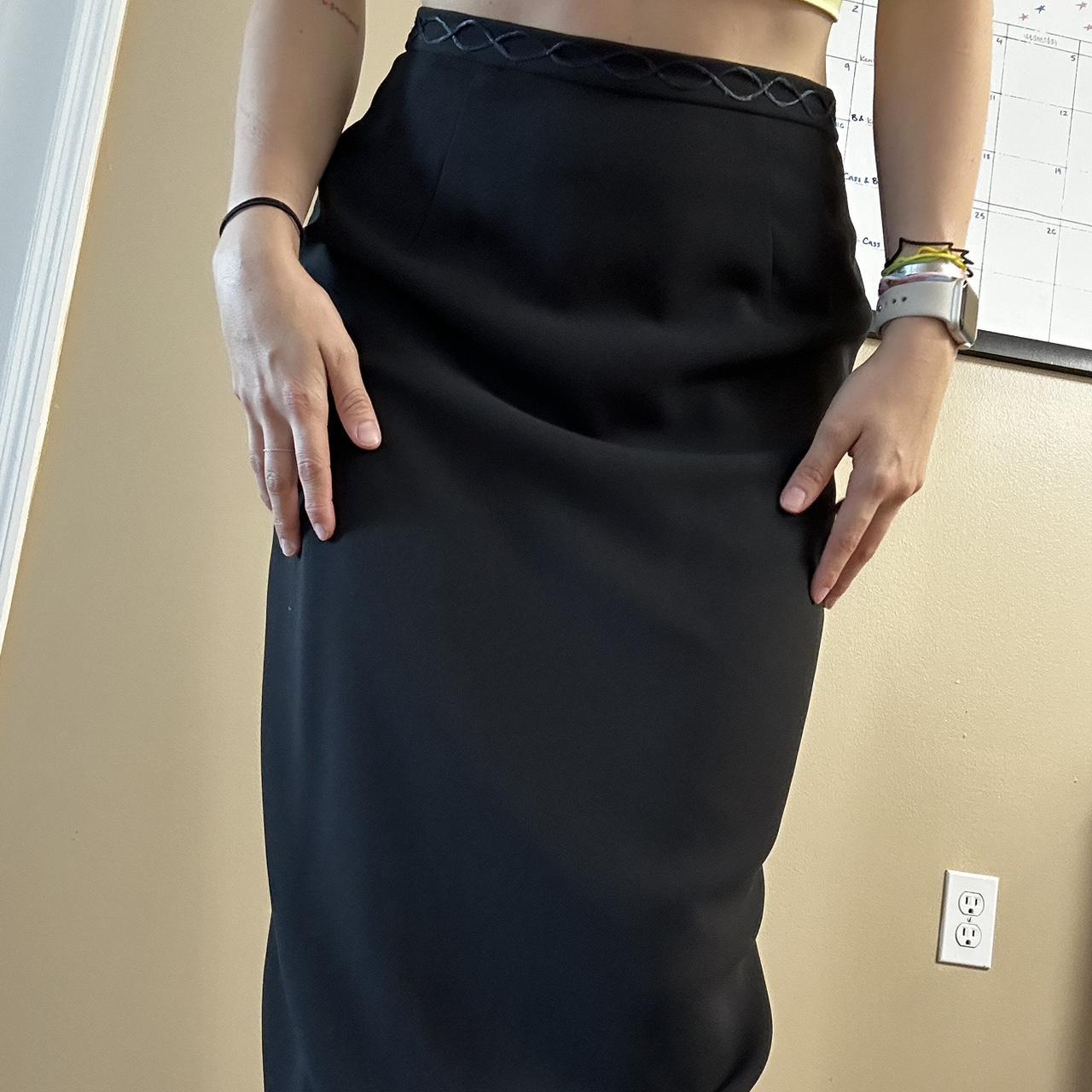 Black long skirt with design on the waist band in... - Depop