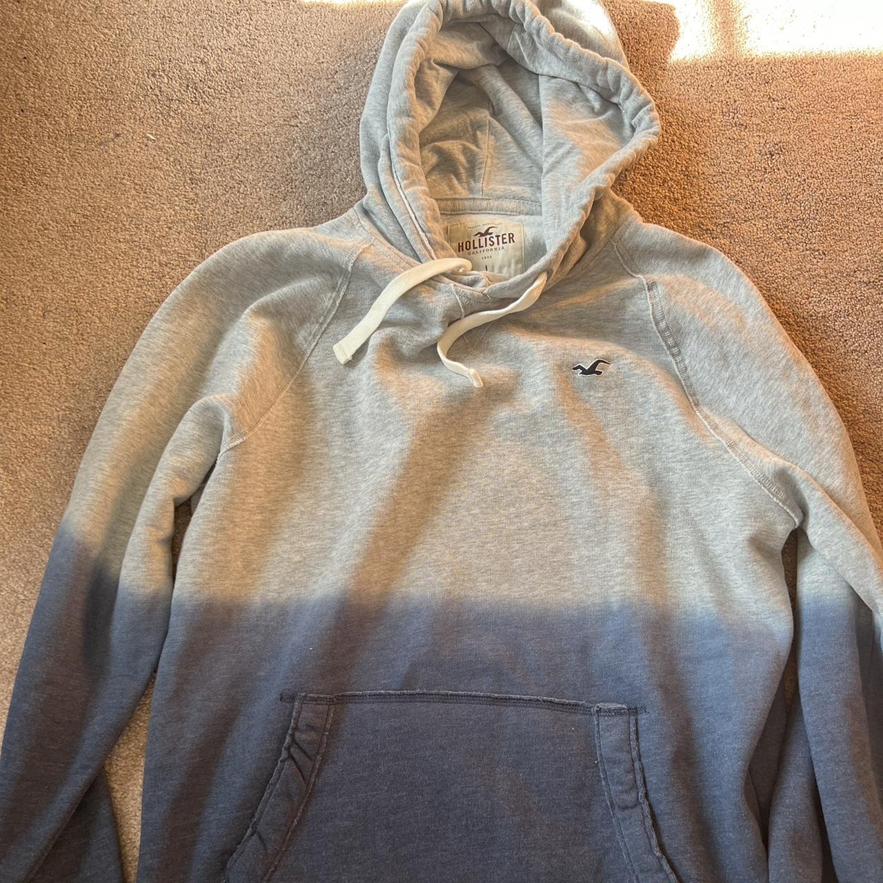 Grey and blue split Holister hoodie Large... Depop