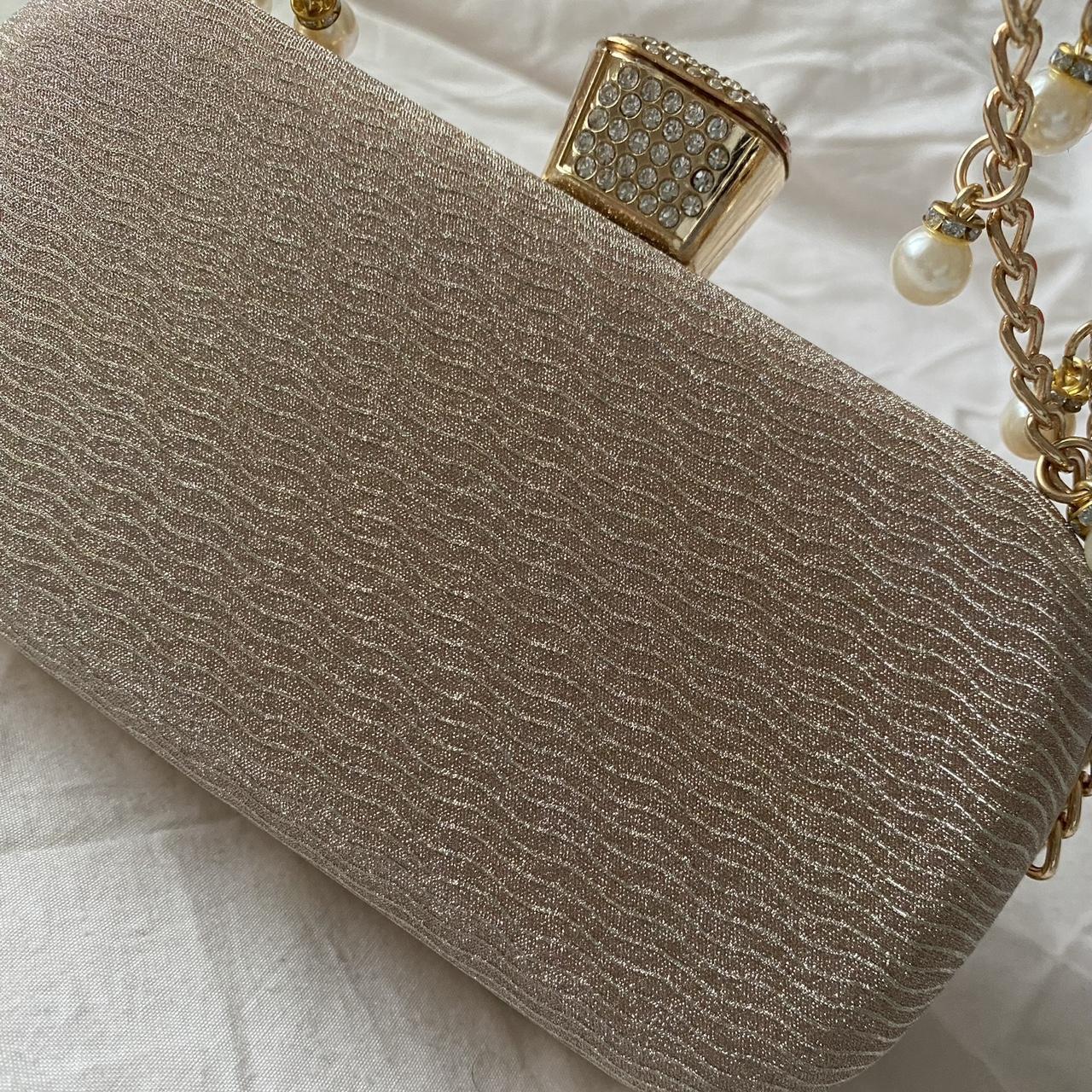 Dull gold clutch bag hotsell