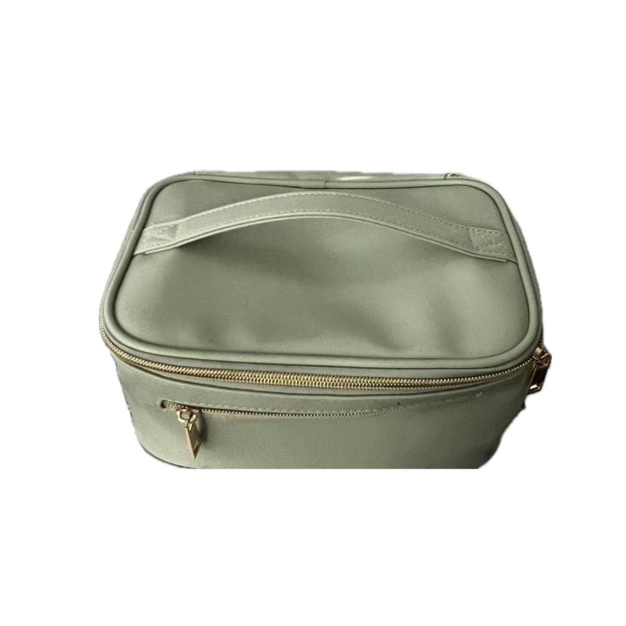 cute sage green makeup bag has some stains inside... Depop