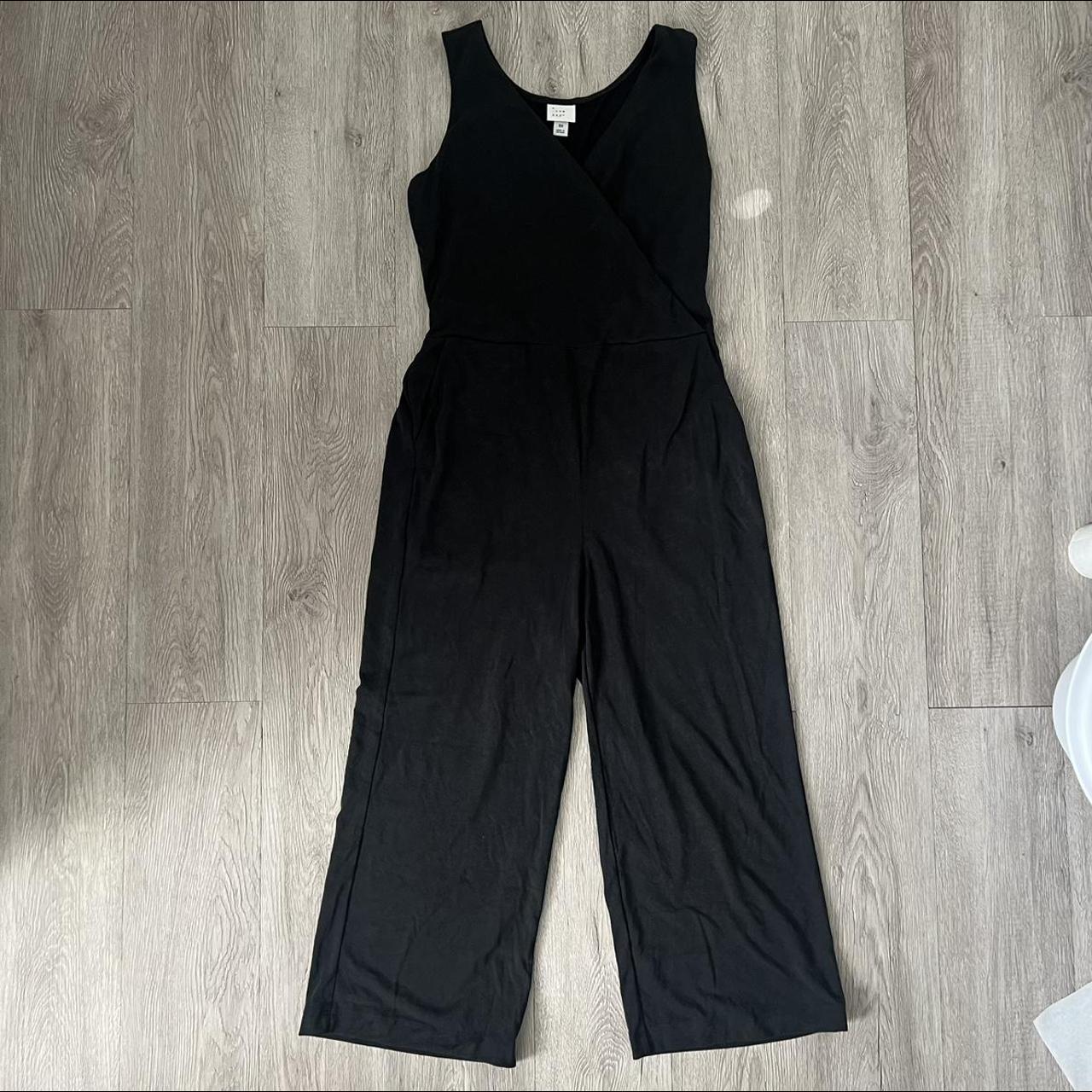 a new day jumpsuit size xs color is a faded black... - Depop