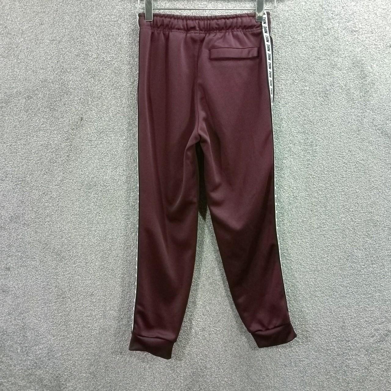 NIKE KIDS BURGUNDY TRACKSUIT BOTTOMS SIDE TAPED... Depop