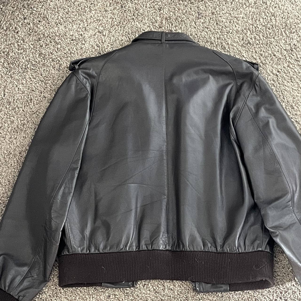 members only leather jacket. size 42. has two holes... - Depop