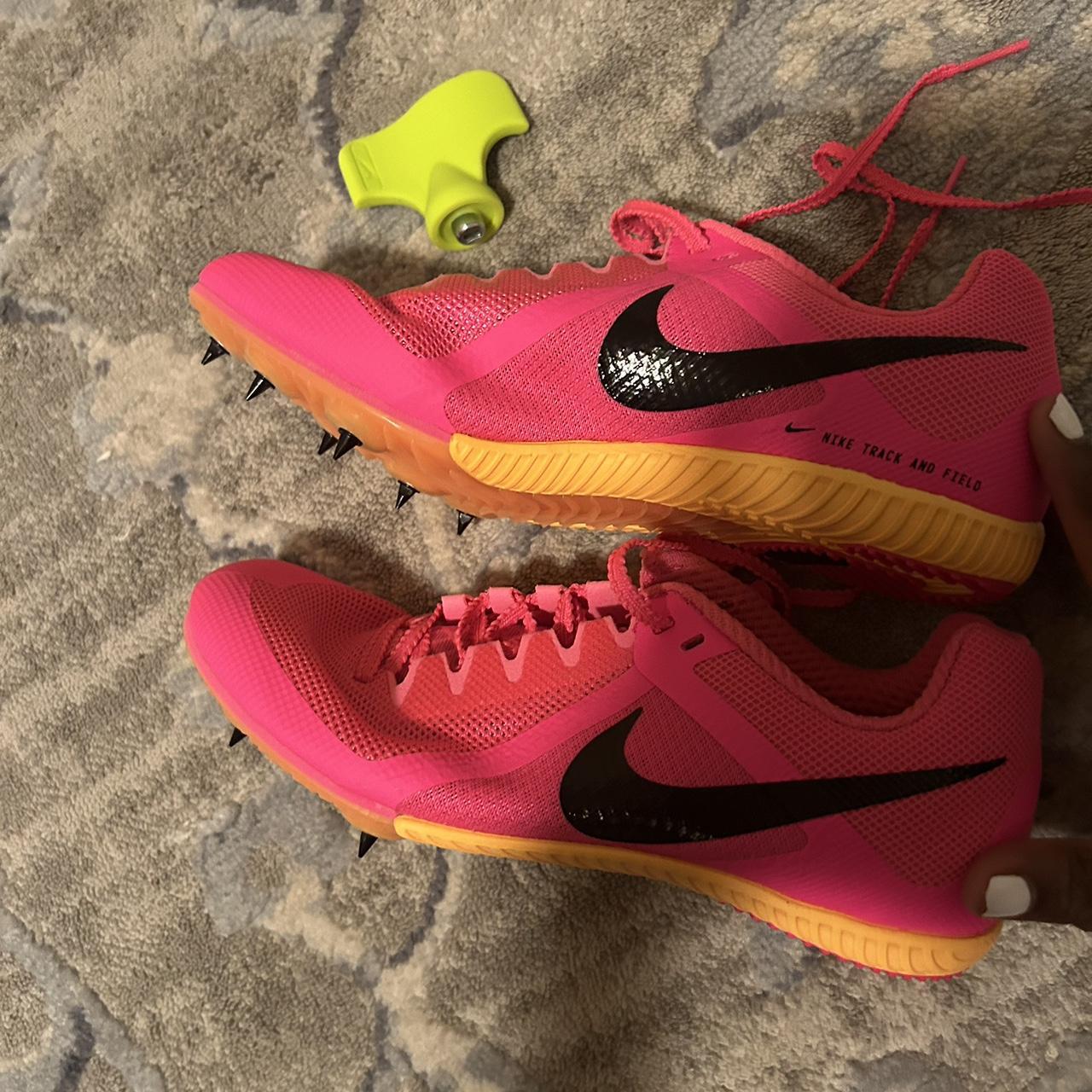 Nike yellow and pink spikes best sale