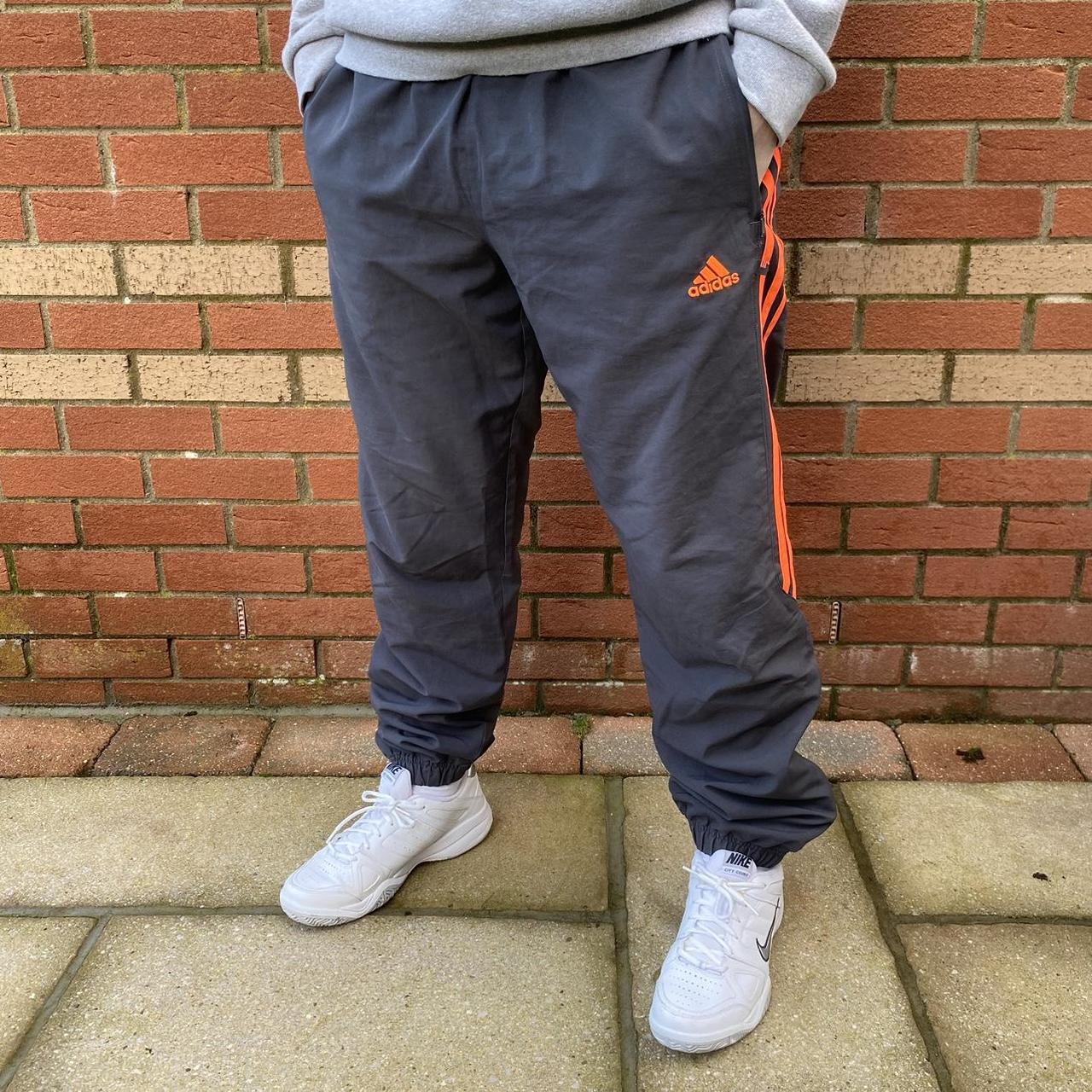 Black and orange adidas tracksuit best sale