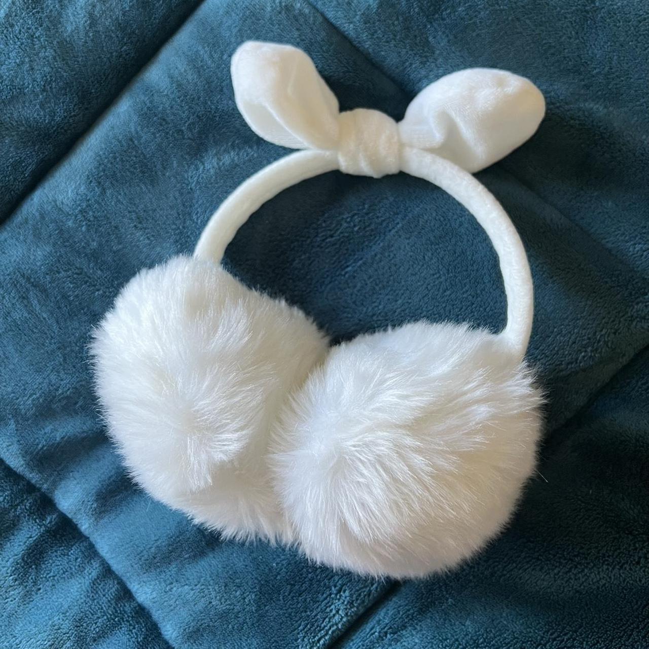 white fluffy earmuffs + cute bow attached! reason... Depop