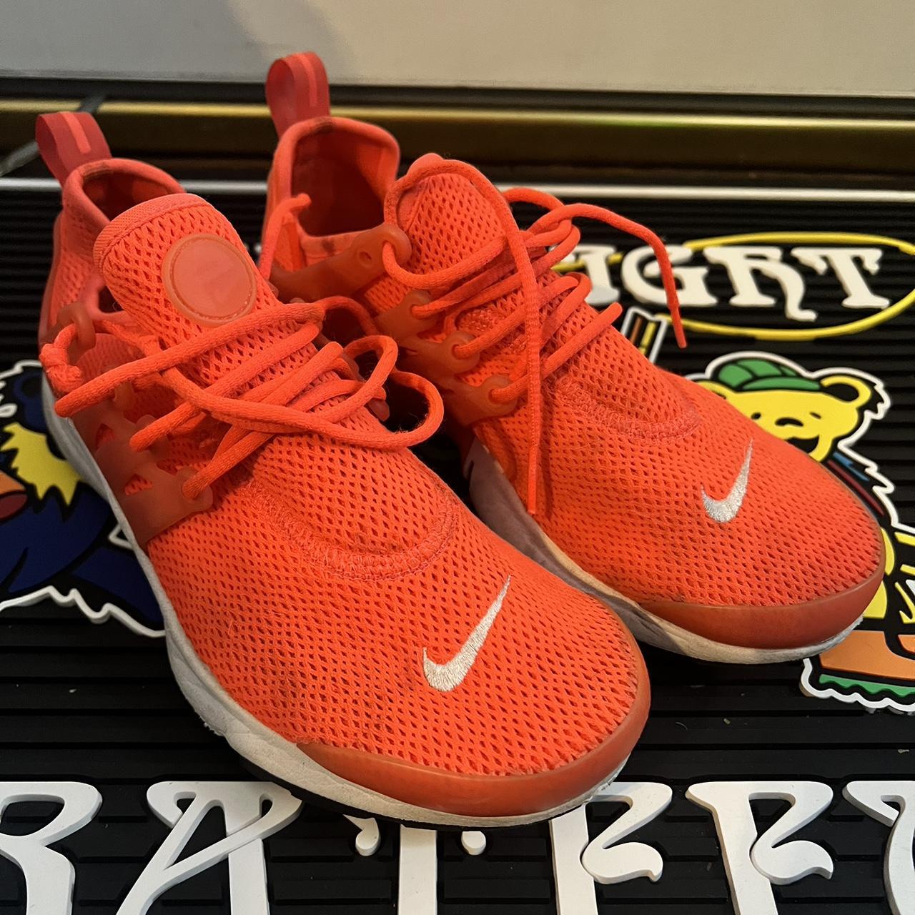 Bright orange nike trainers best sale