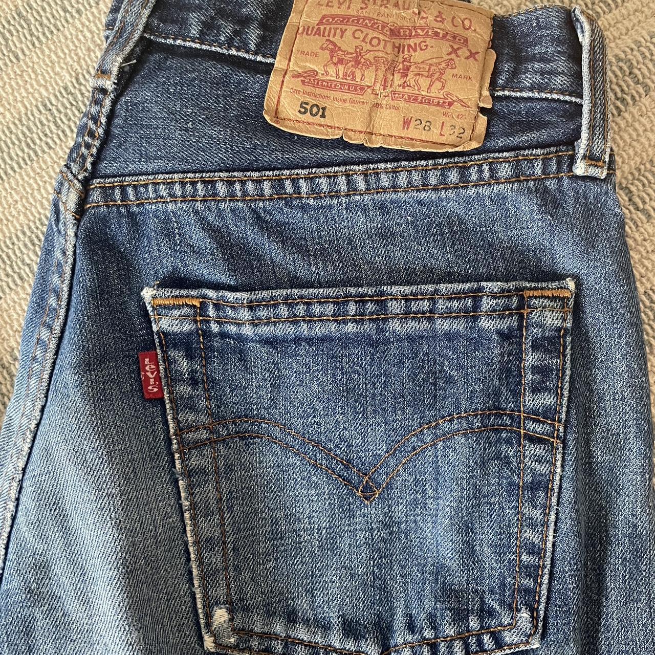 levis jeans 502 dark washed little hole at the back... - Depop