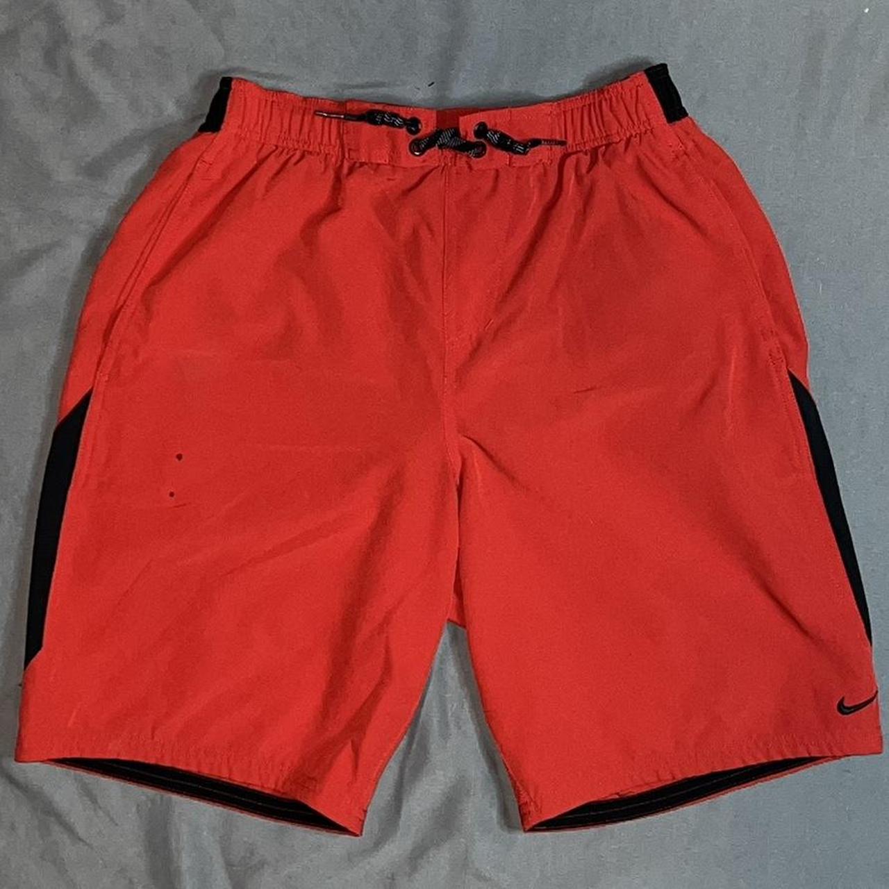 Nike red and black swimming trunks/swimming shorts... - Depop