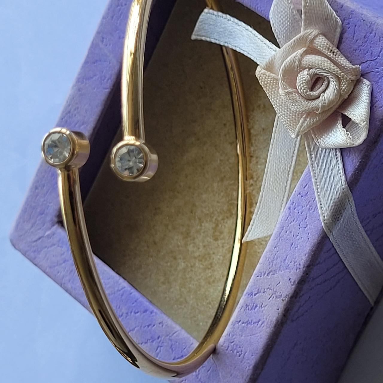 Beautiful gold plated open bracelet with 2 white... Depop