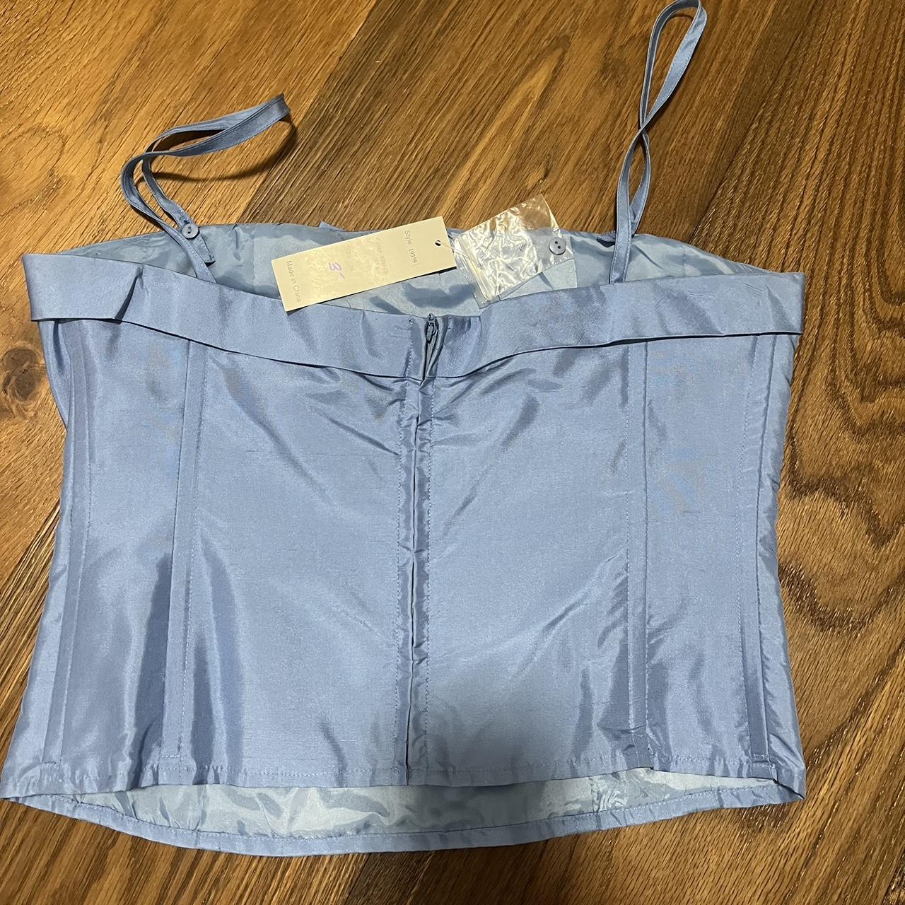 super cute baby blue bow top, corset fit, never... - Depop