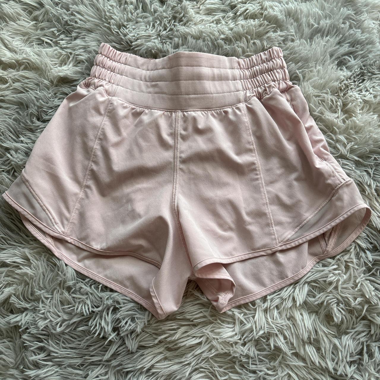 Lululemon sonic pink hotty hot shorts Size 4 Message - Depop