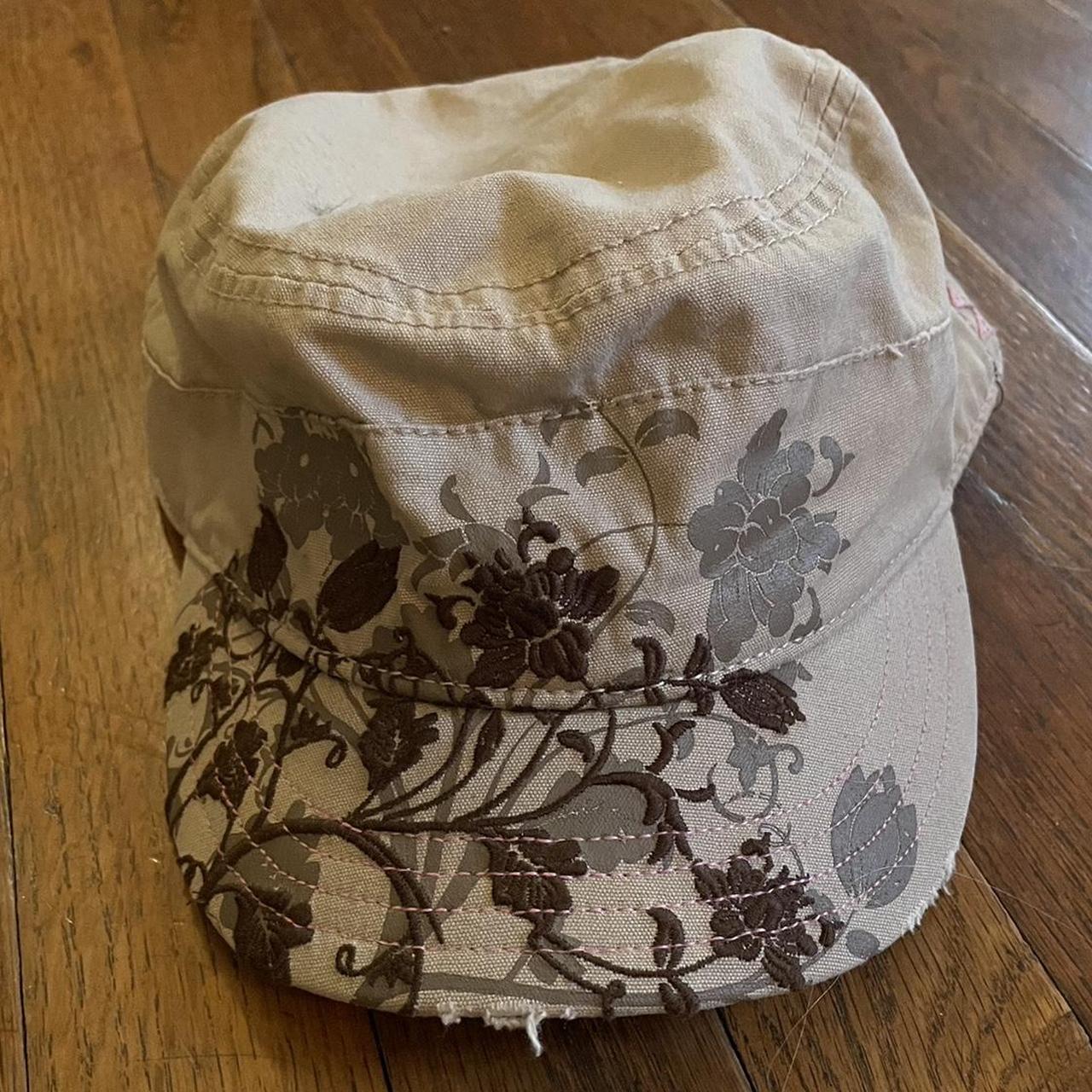 Tan hat with brown floral design and pink stitching... - Depop