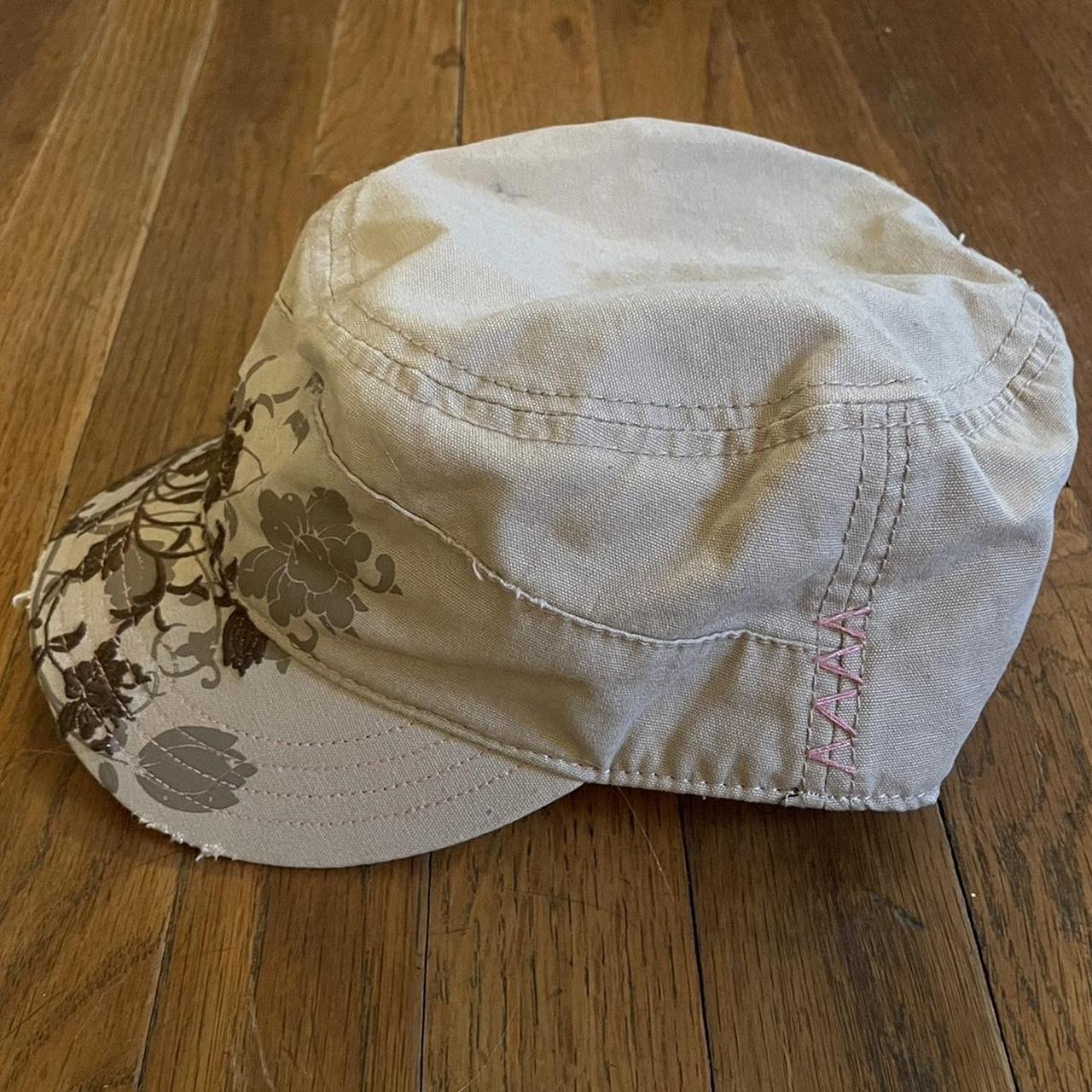 Tan hat with brown floral design and pink stitching... - Depop