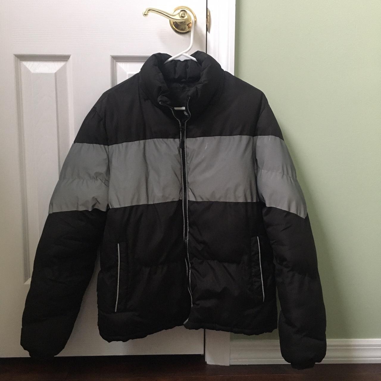 Black puffer jacket with gray reflective stripe