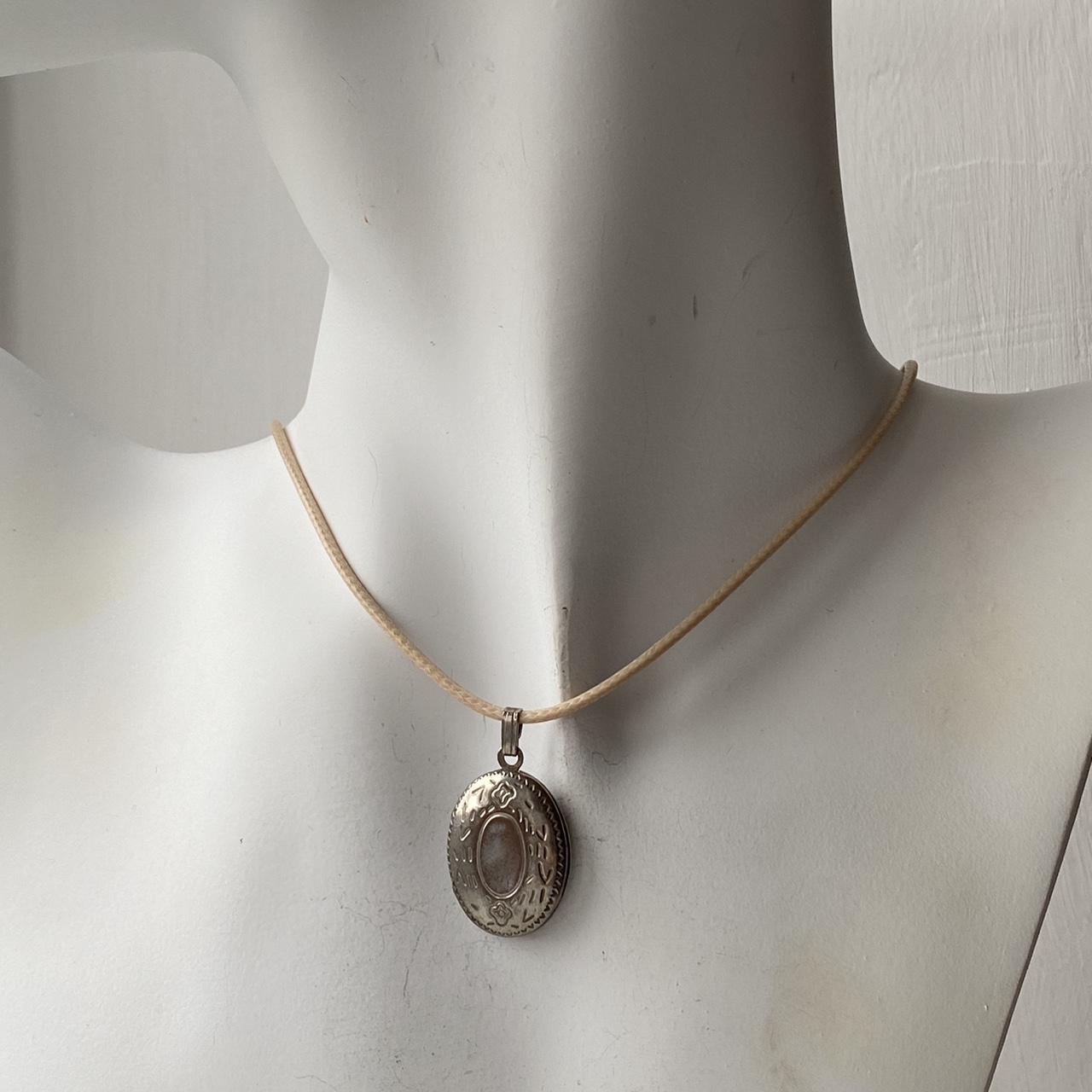 Vintage silver locket pendant on beige rope necklace... - Depop