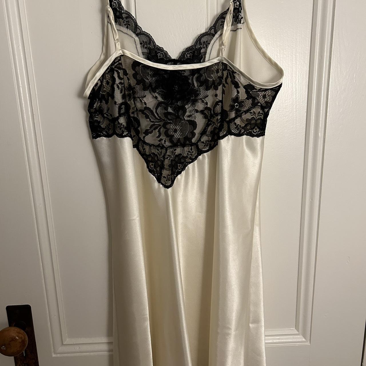Cream mini slip dress with black lace details. Fits... - Depop