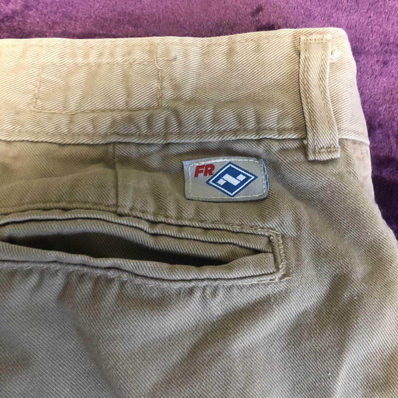 FR Low rise tan colored pants with logo Size 2... - Depop