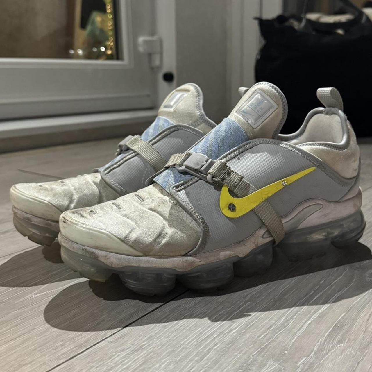 Grey and has yellow vapormax