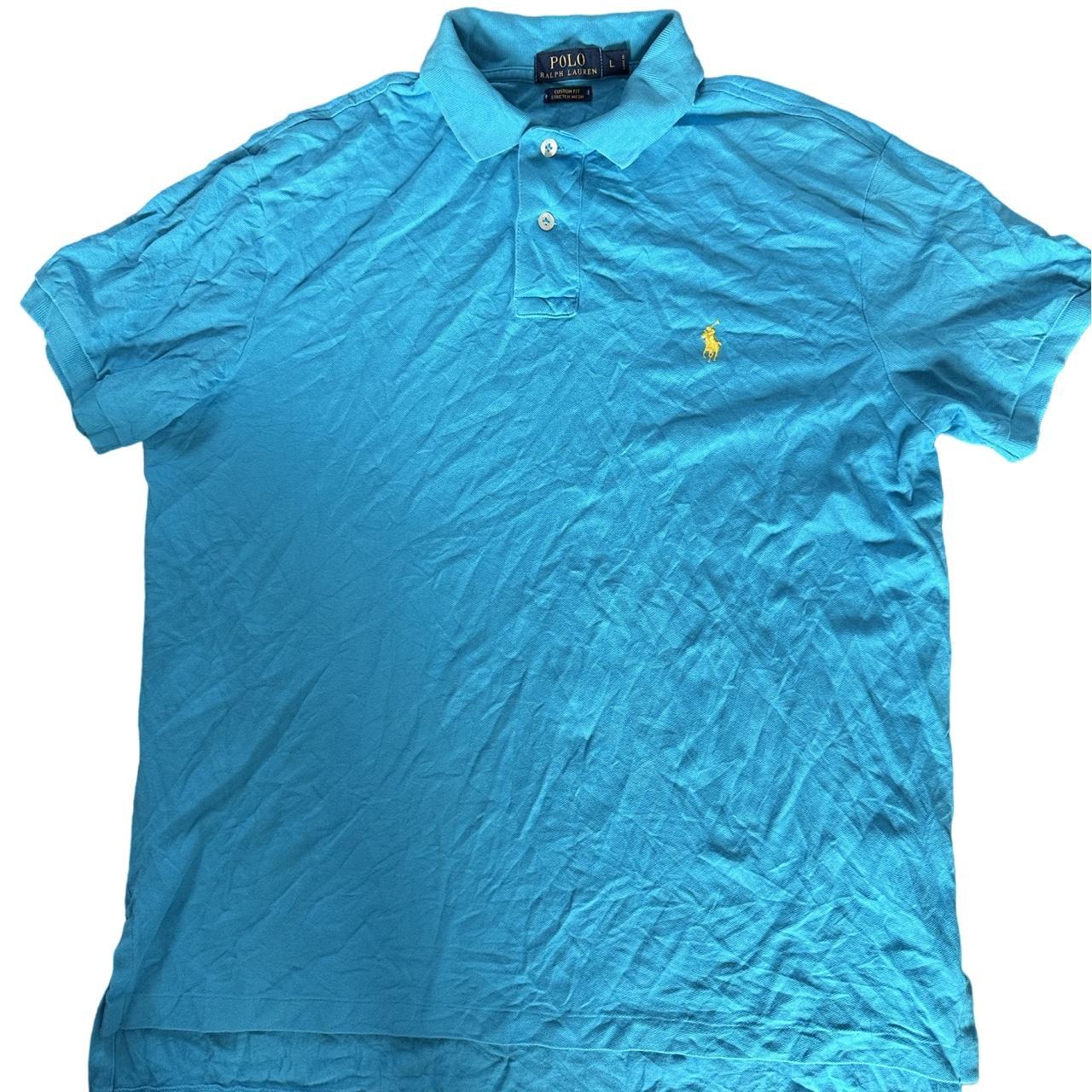 Blue polo shirt with yellow horse on sale