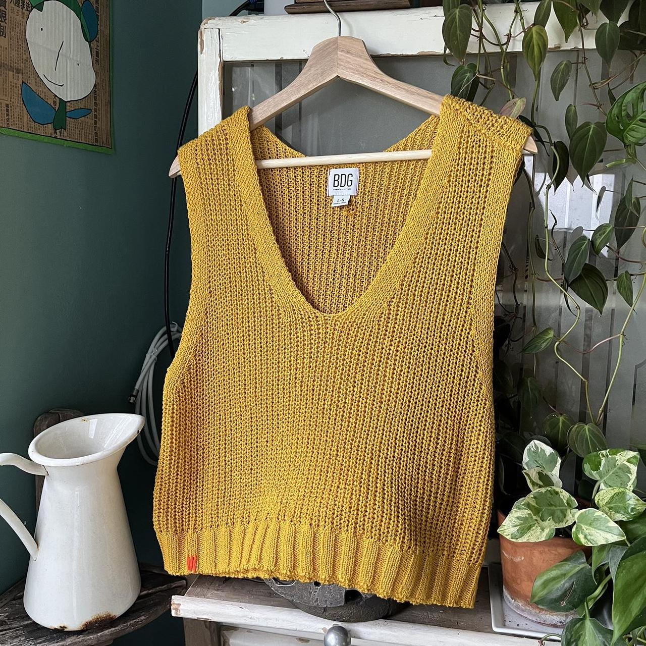 mustard yellow sweater vest. pretty roomy so it's... Depop