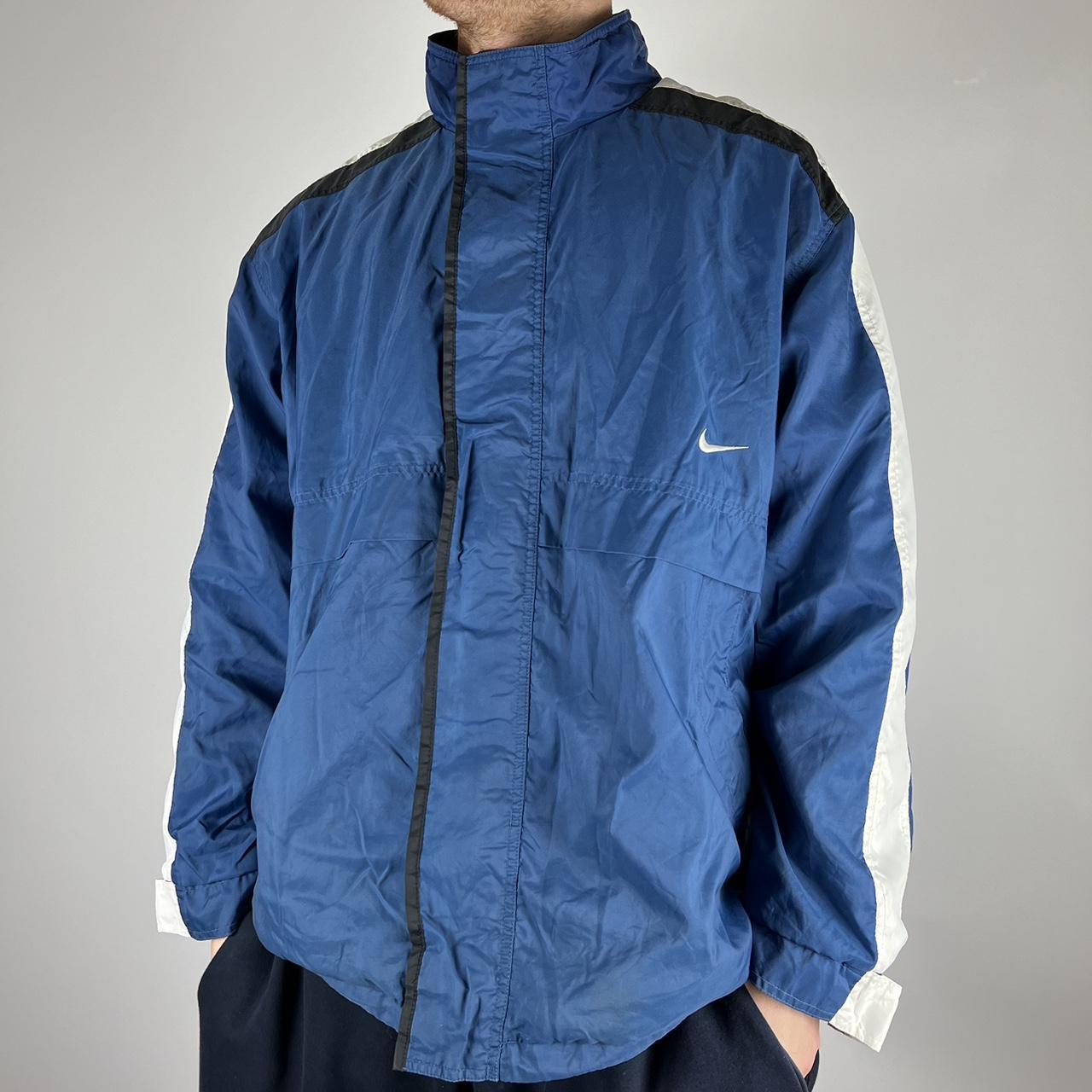 Vintage Nike blue jacket with white down the arms... - Depop