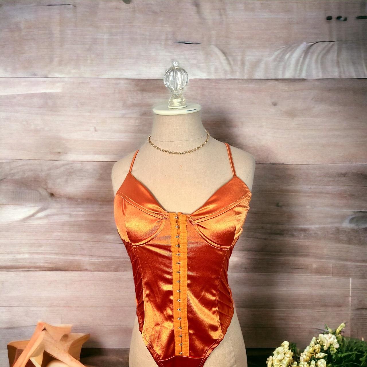 Metallic bold orange bust bodysuit, cheeky bottom... Depop