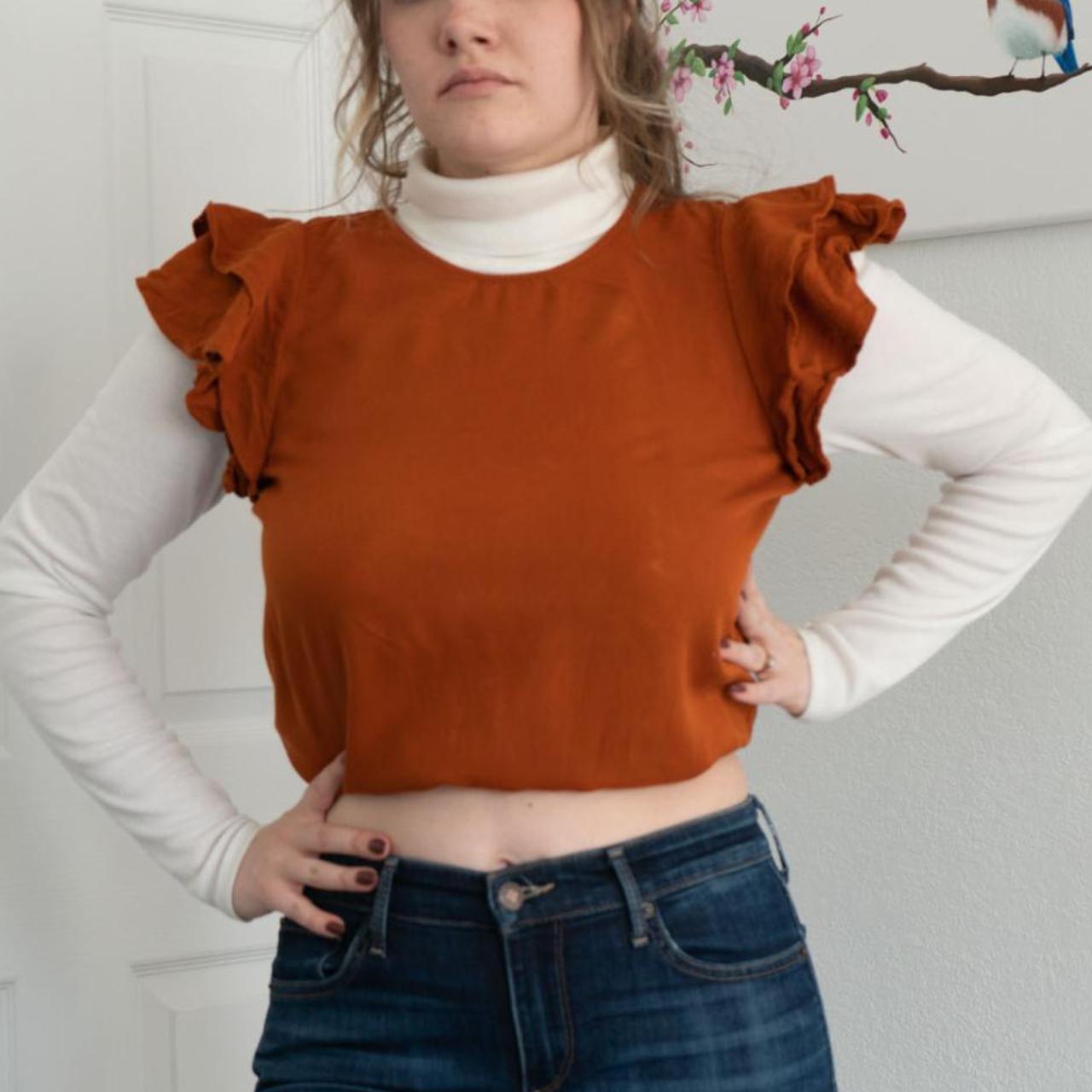 Burnt orange rust ruffle sleeve top. Cute by itself