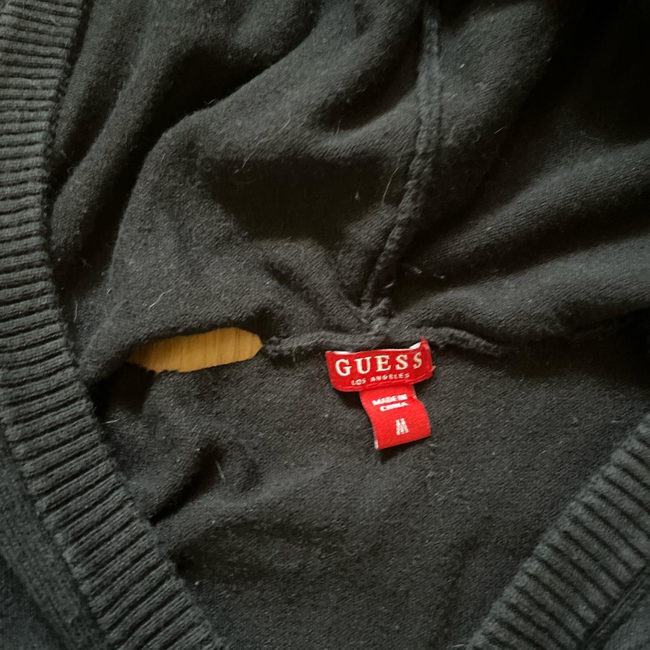 Black Guess hoodie worn, flaws included in... Depop