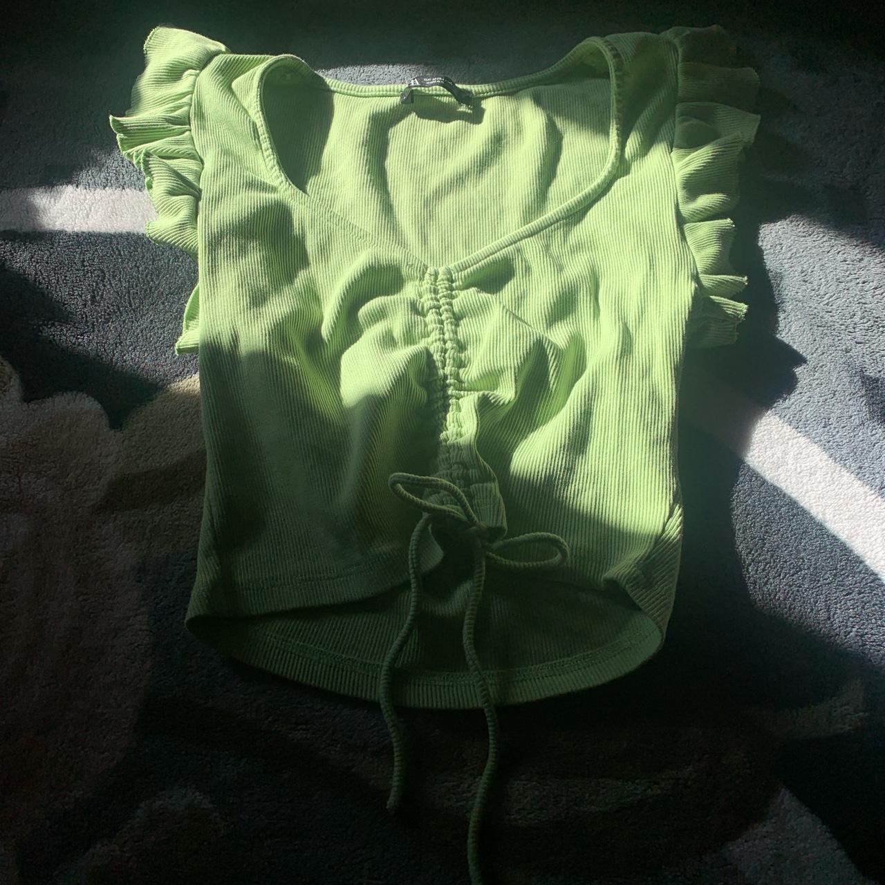 Cute green top w/ ruffle shoulder and string... - Depop