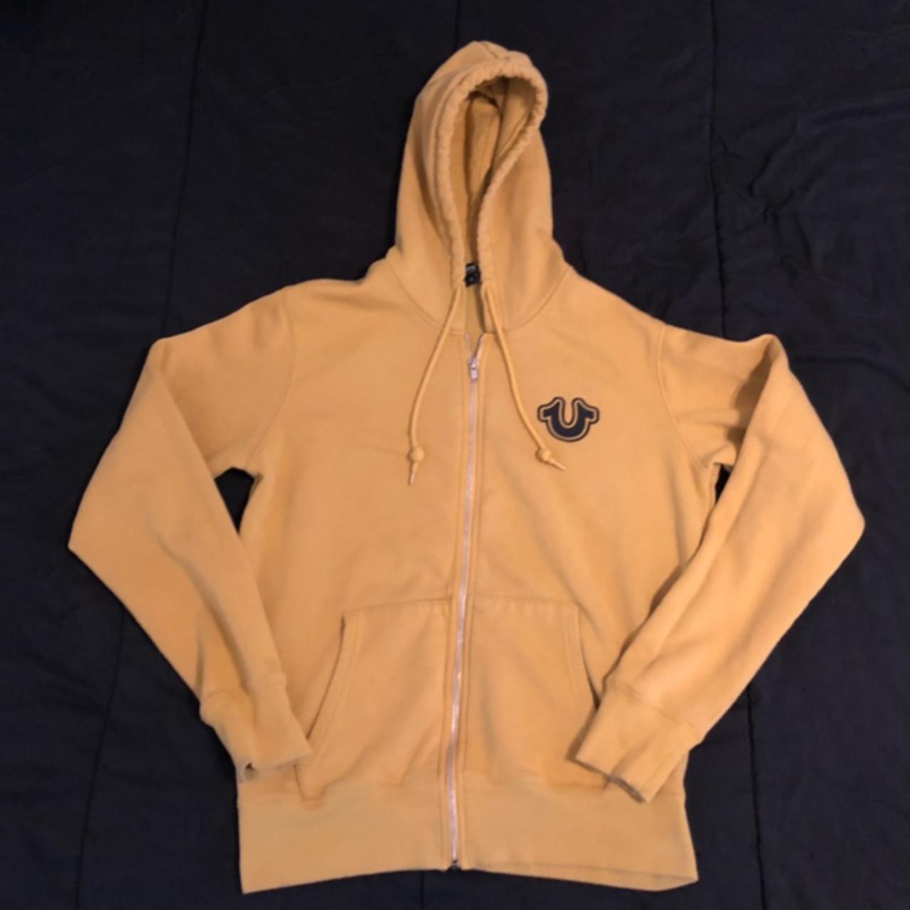 Size Small yellow True Religion hoodie. Black stain... Depop