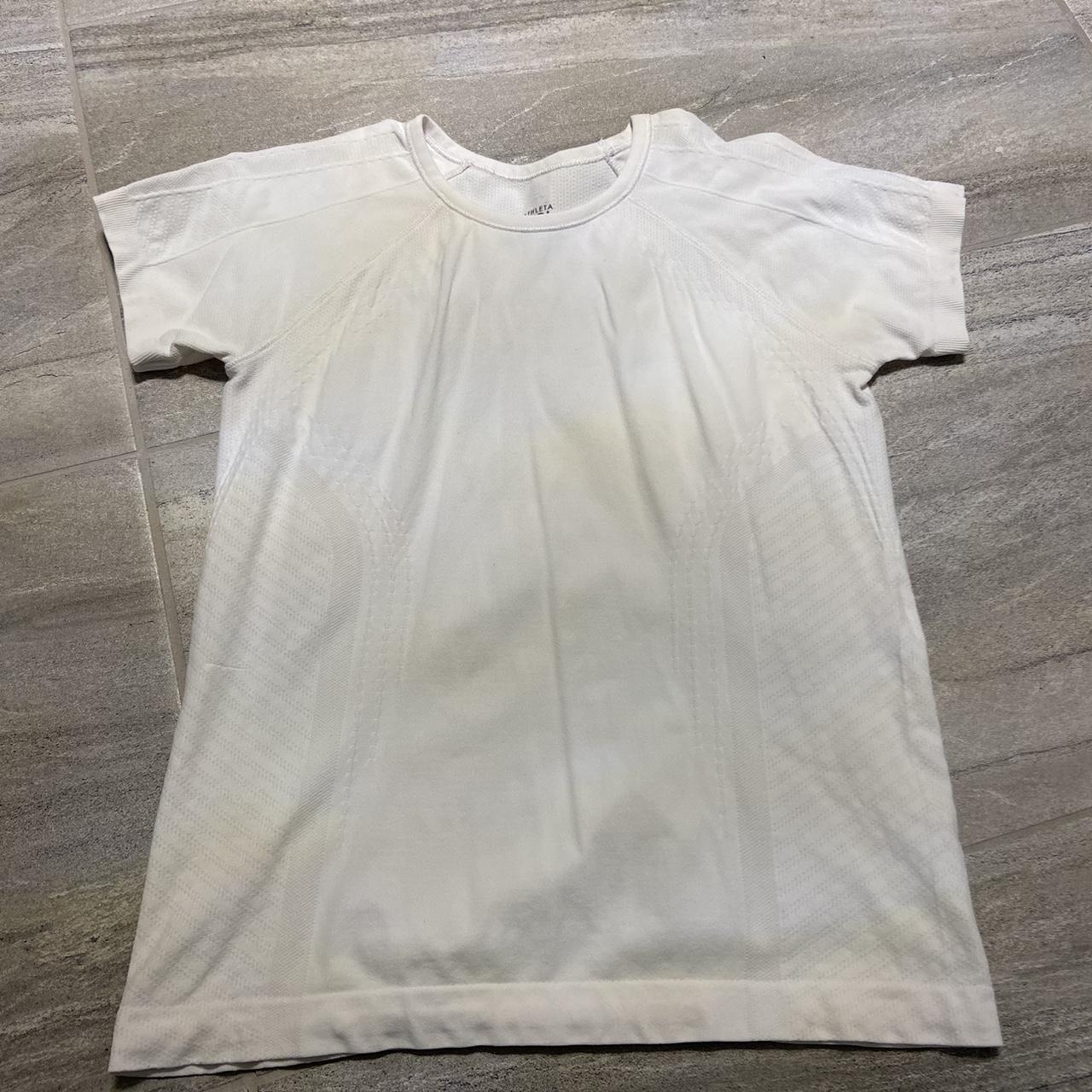 white athleta shirt similar to a lululemon... Depop