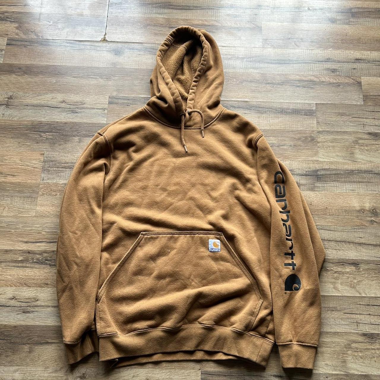 Carhartt tan hoodie with front pocket and logo on... - Depop