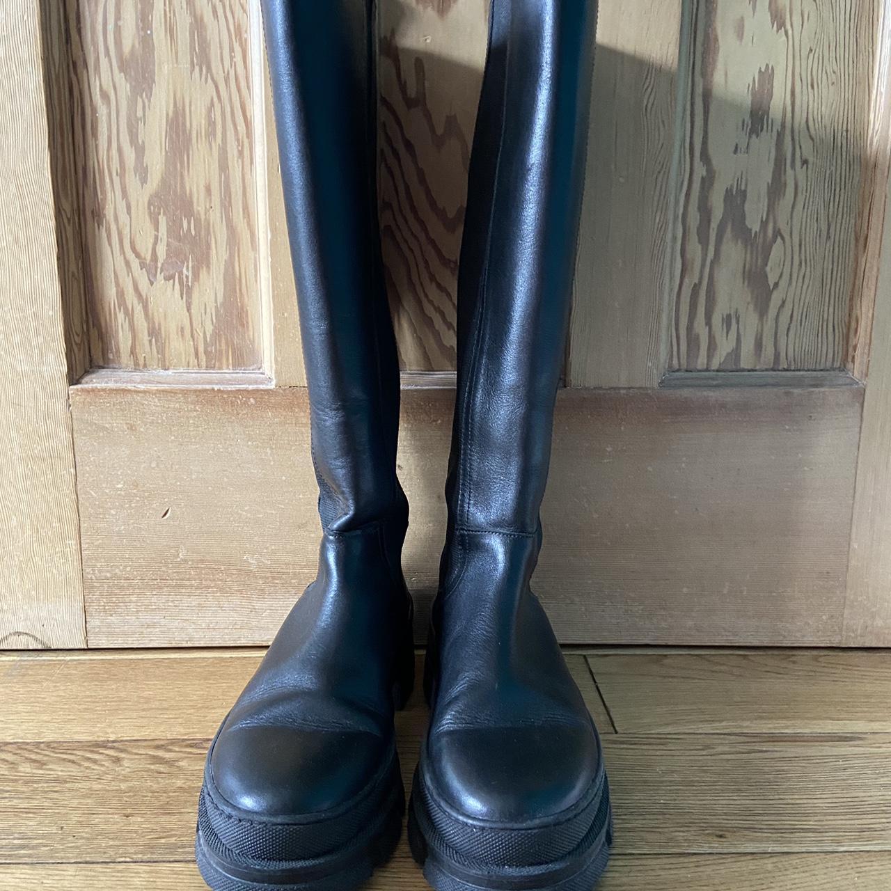 Knee high biker boots with elastic side panel from... - Depop